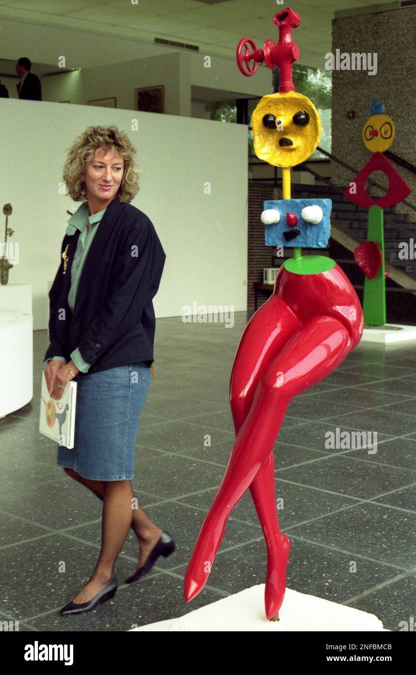 A woman walks past the sculpture