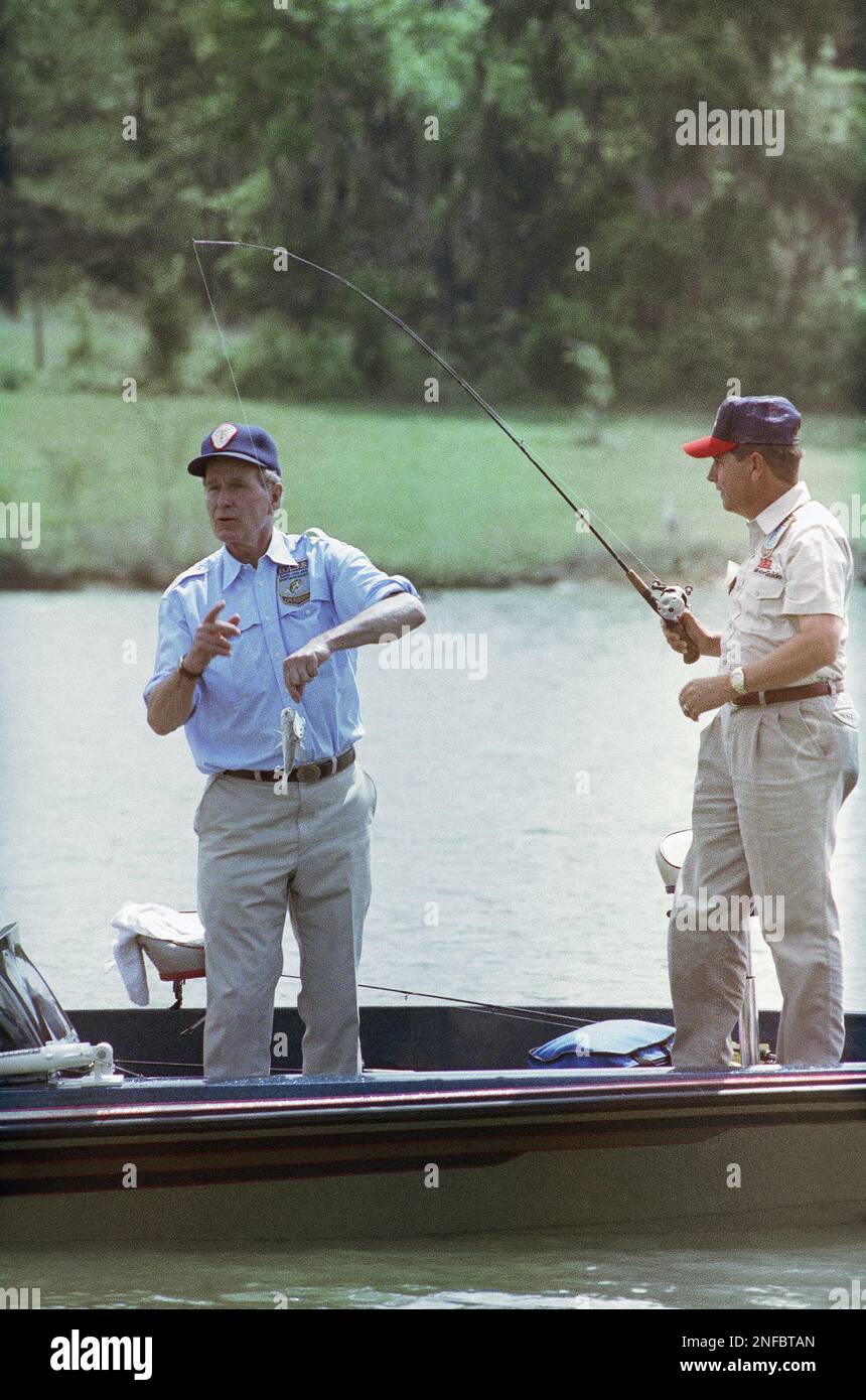 https://c8.alamy.com/comp/2NFBTAN/president-george-h-bush-removes-a-fish-from-his-partner-orlando-wilsons-hook-while-participating-in-benefit-fishing-tournament-in-pintlala-ala-on-saturday-april-13-1991-the-president-is-taking-part-in-the-tournament-that-will-benefit-the-pintlala-baptist-church-south-of-montgomery-ap-photobarry-thumma-2NFBTAN.jpg