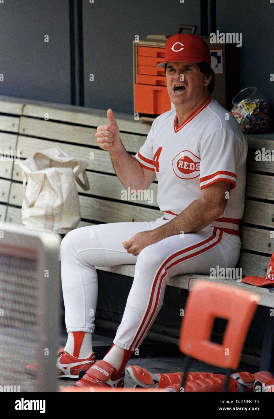 Cincinnati Reds manager Pete Rose gives a thumbs up sign while sitting ...