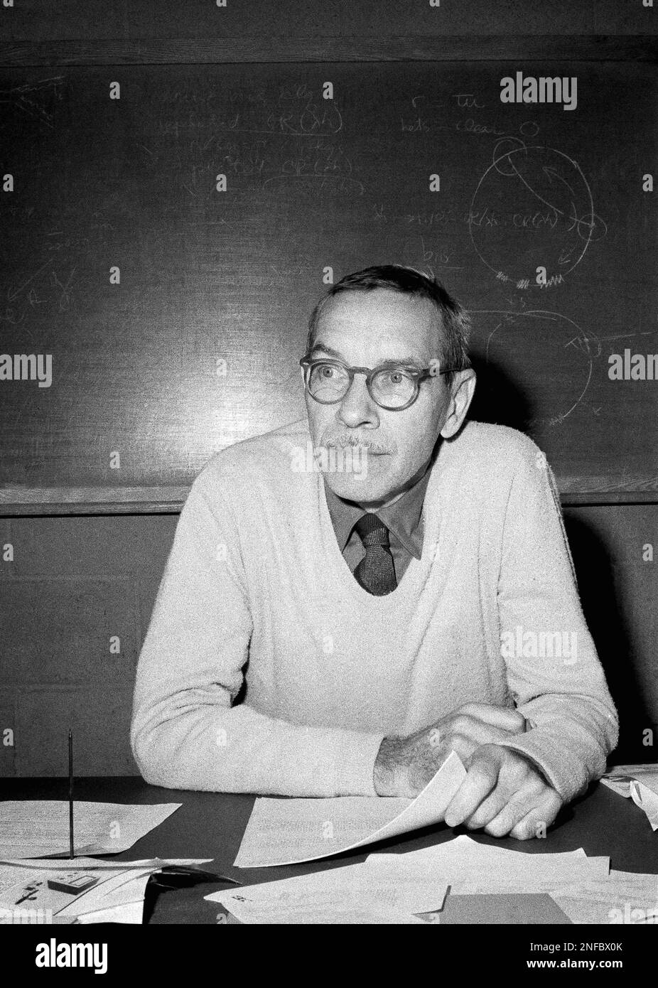 Dr. Alfred Hershey is shown at work in his laboratory in Cold Spring