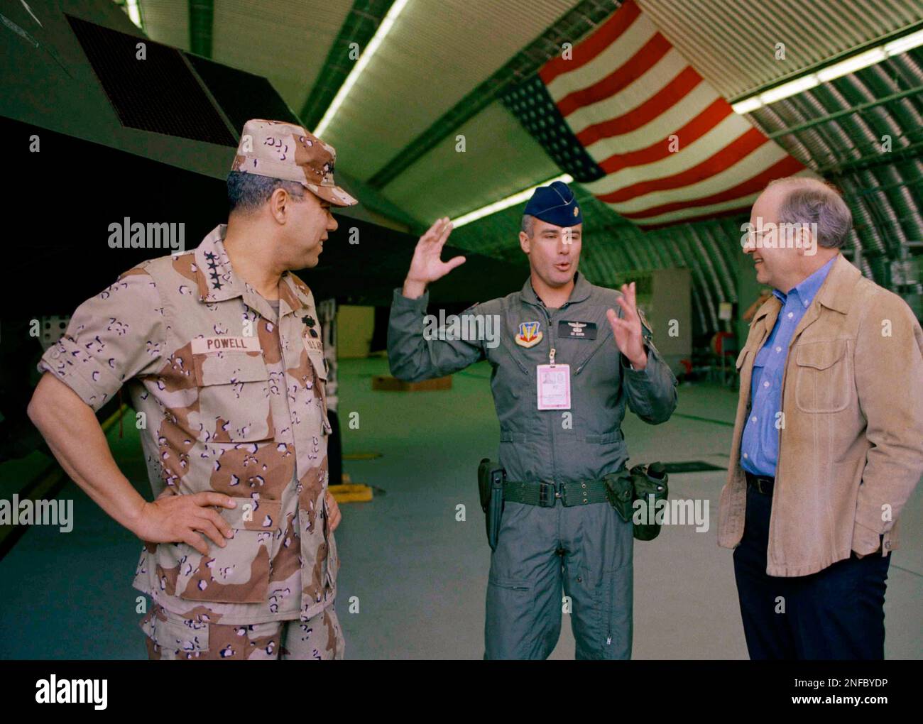 Air Force Maj. Lee Gustin, pilot of the F-117 Stealth fighter at left,  tells Gen. Colin Powell, chairman of the Joint Chiefs of Staff, left, and  Defense Sec. Dick Cheney about the