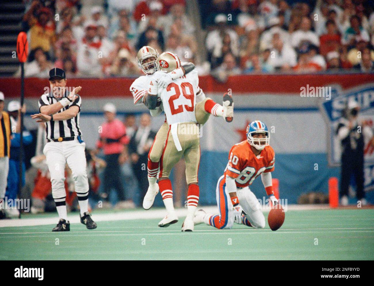 San Francisco 49er Don Griffin (29) and Tim Mckyar (22) celebrate after