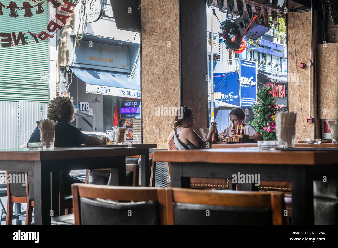 Customers at a bar in Bui Vien in District 1, Ho Chi Minh City, Vietnam. Stock Photo