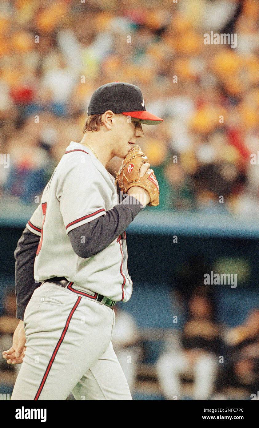 Atlanta Braves starting pitcher Steve Avery walks off the field after he  was removed, pitching only one-third of an inning against the Pittsburgh  Pirates in Game 5 of the National League Championship