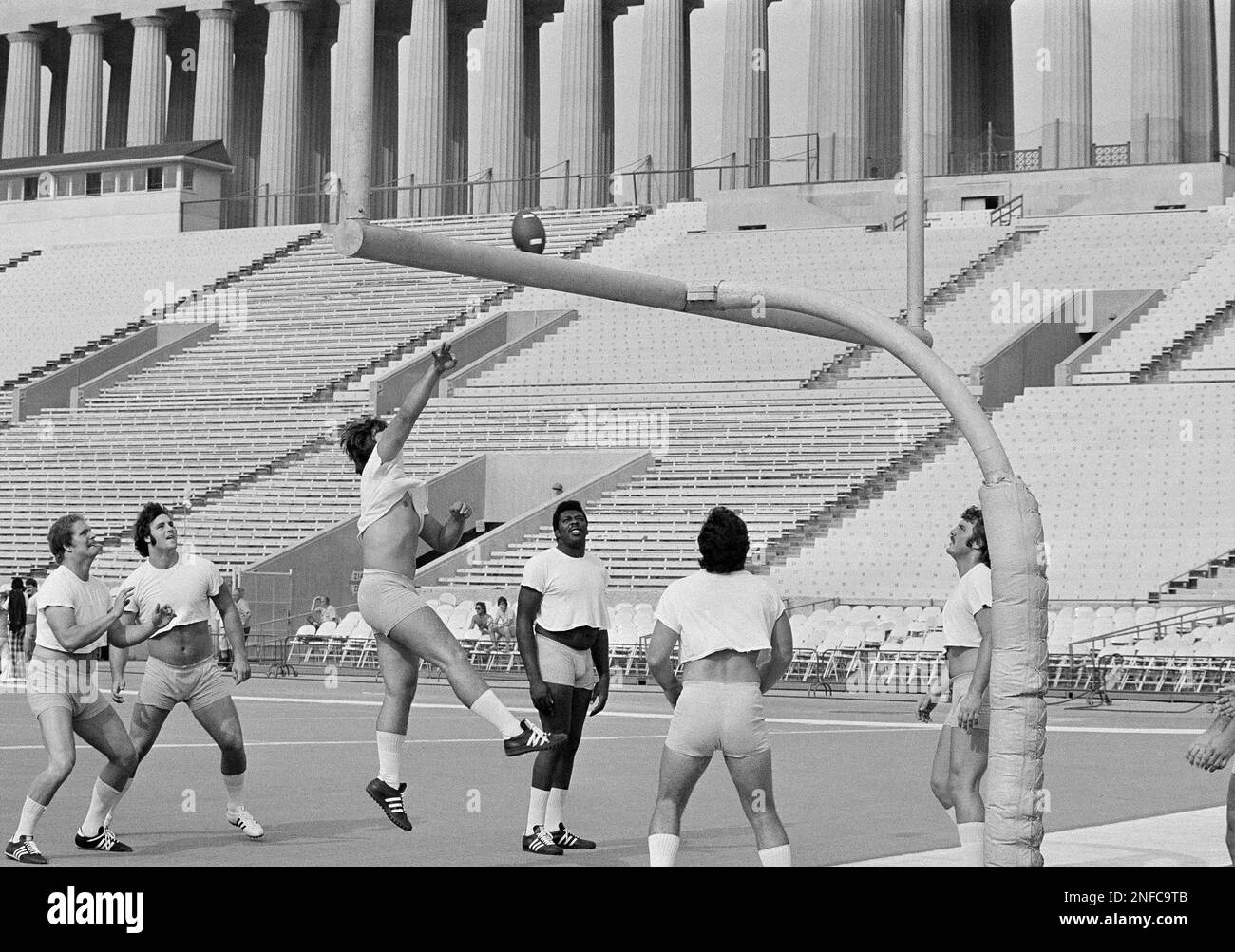 College AllStars play a modified game of volleyball, with a football