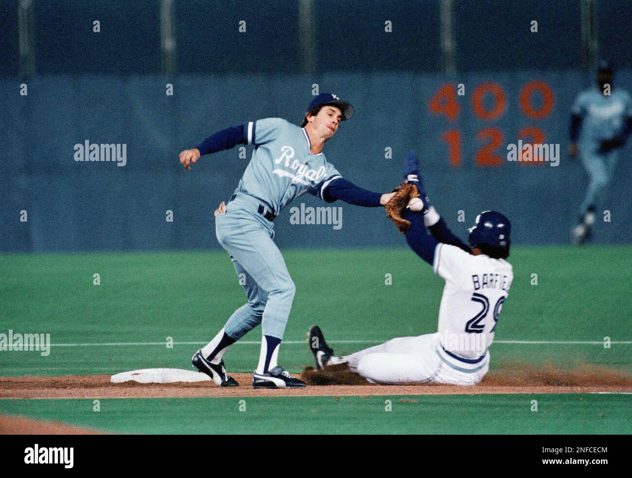 Royals shortstop Buddy Biancalana, left, reaches for errant throw as Blue  Jays Jesse Barfield slides into second with a stolen base in the 1985 AL  playoffs. (AP Photo Stock Photo - Alamy