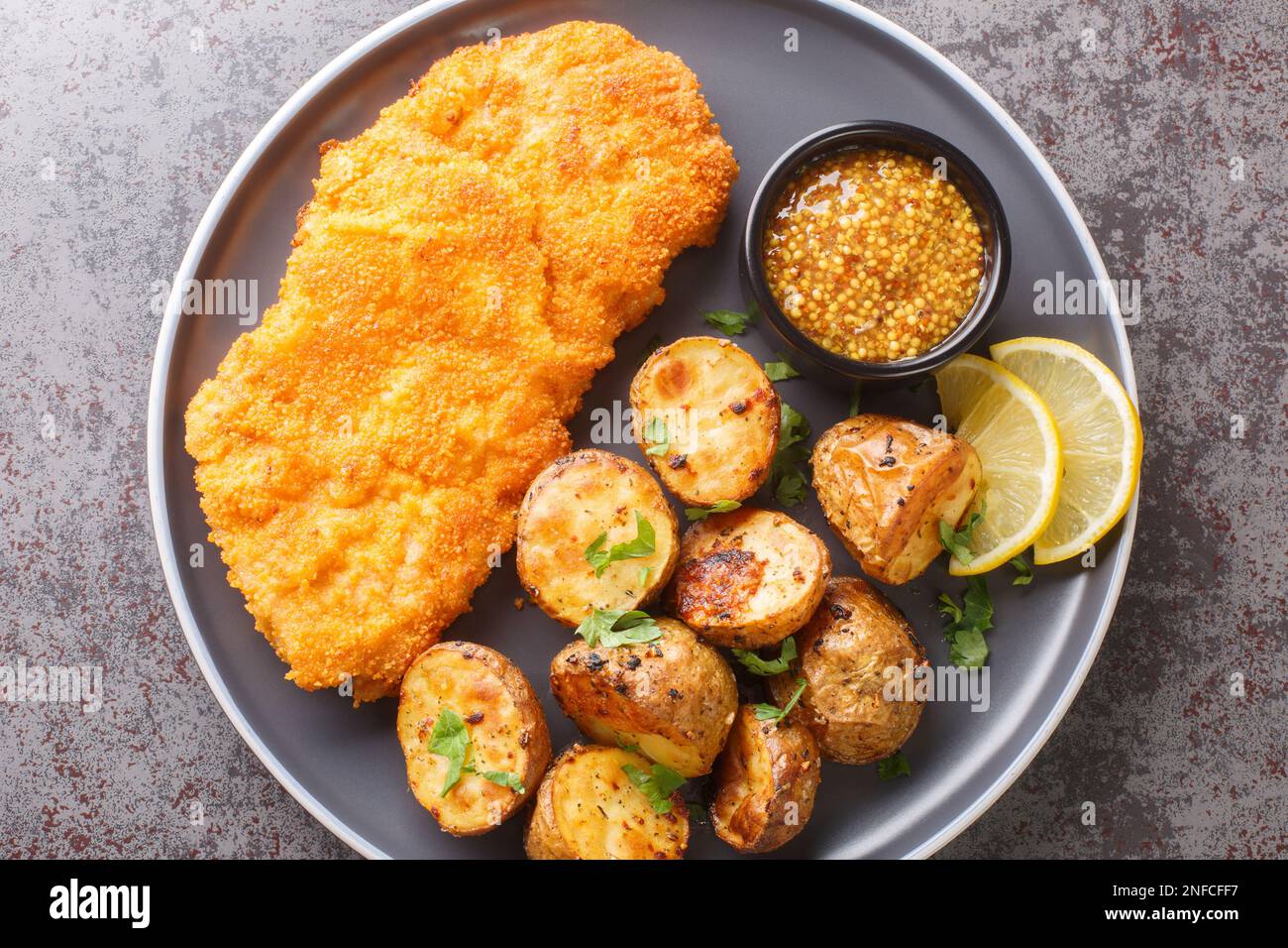 Delicious German Munich schnitzel fried breaded with mustard and