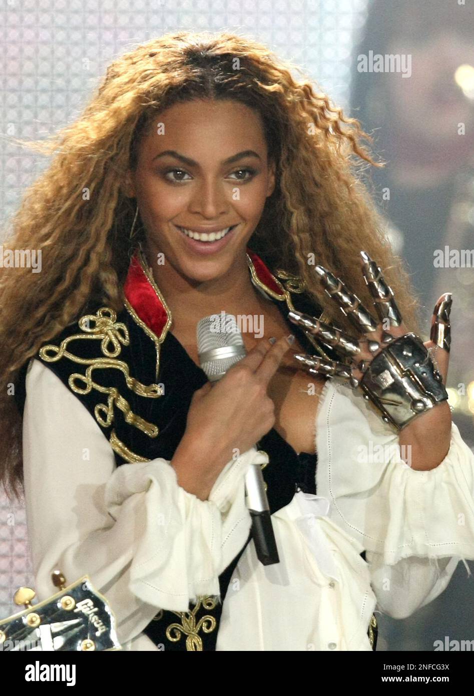 American singer Beyonce performs before receiving the award for