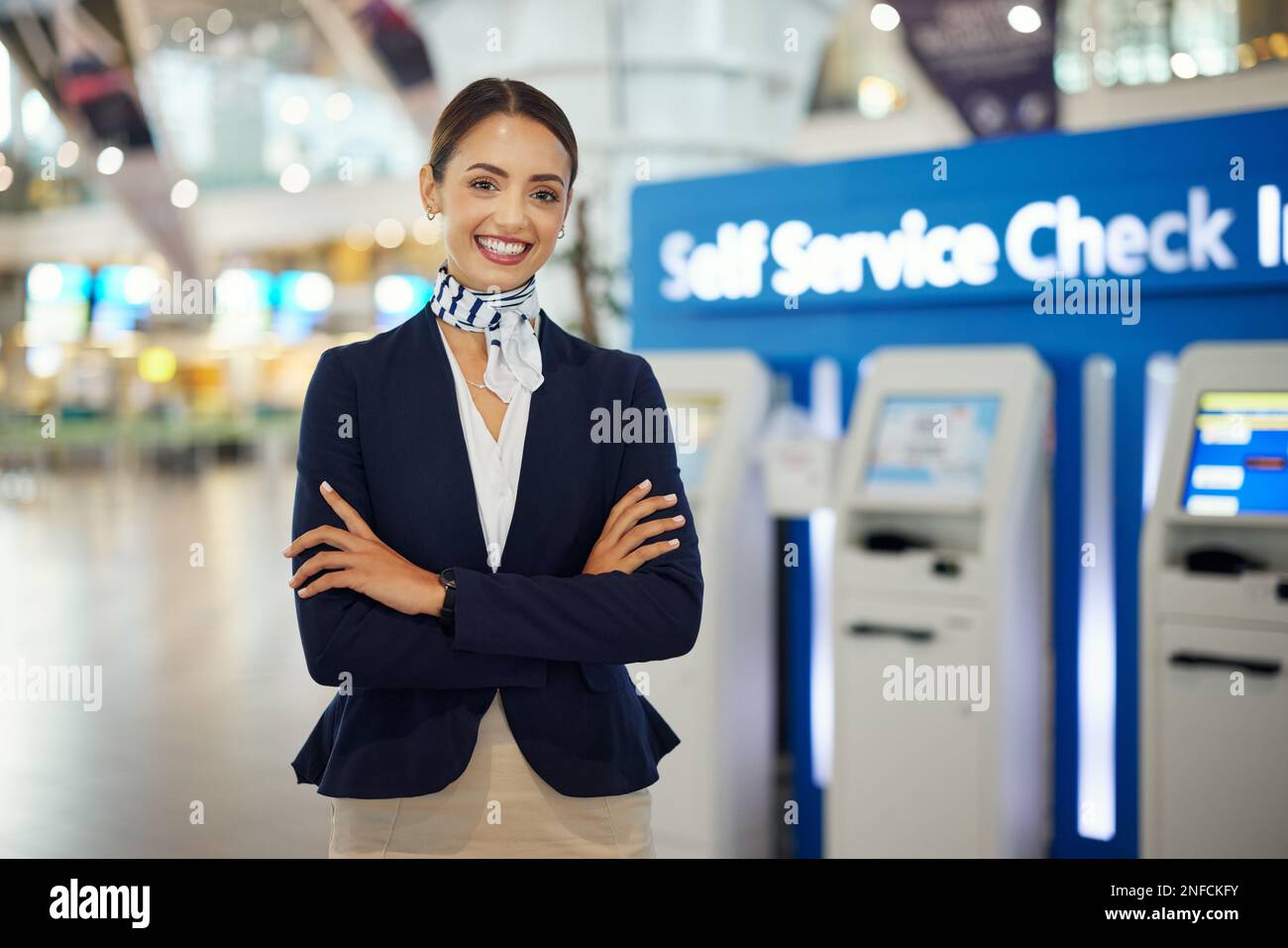Woman, passenger assistant and arms crossed at airport by self service ...