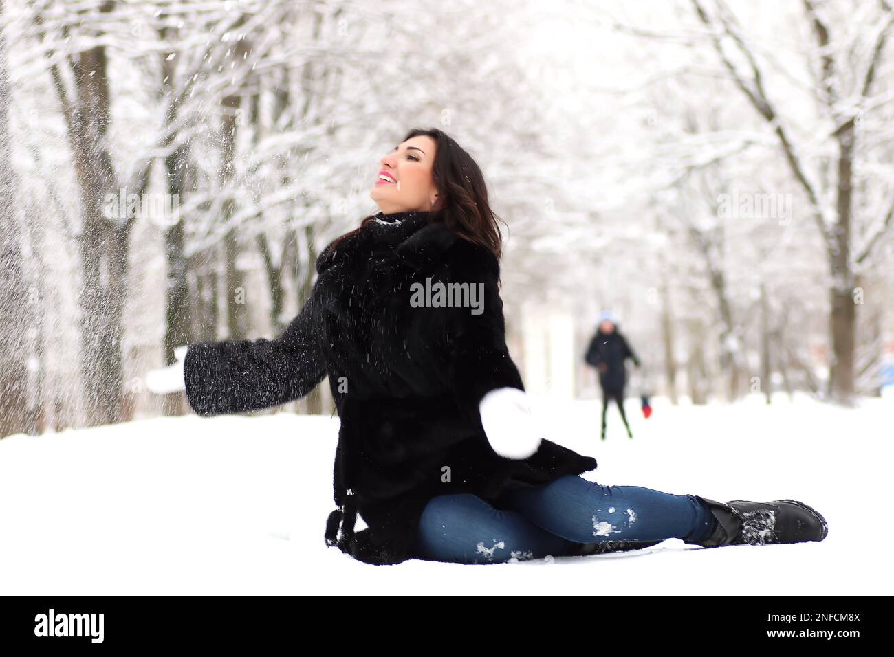 A young woman walk in a winter park outdoor Stock Photo - Alamy