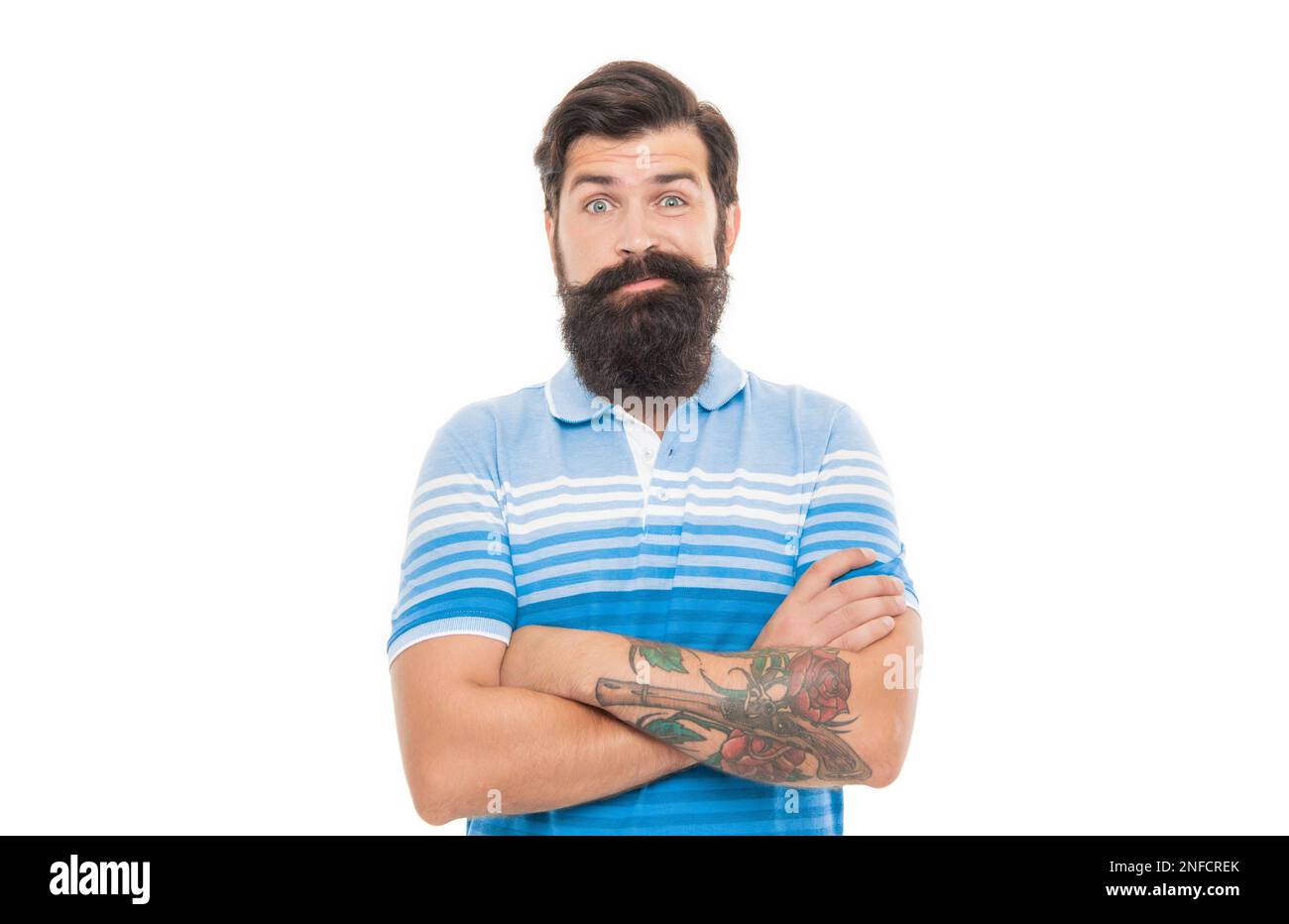 Bearded man in doubt. Doubtful man raising brows. Unshaven man keeping arms crossed Stock Photo