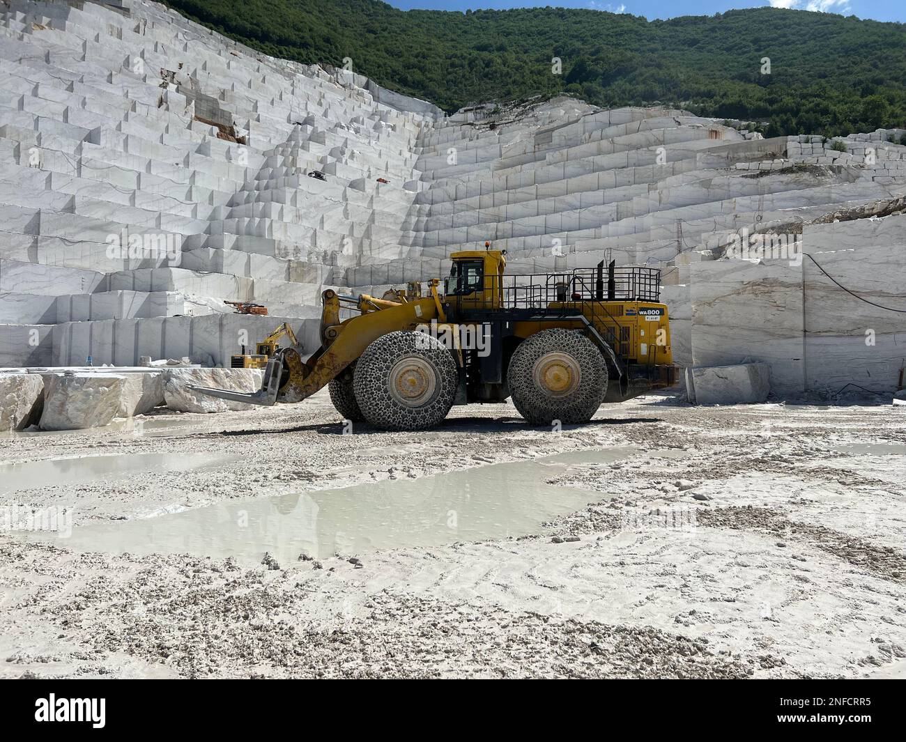 Wheel loader working at a huge marble quarry in Europe. Transporting