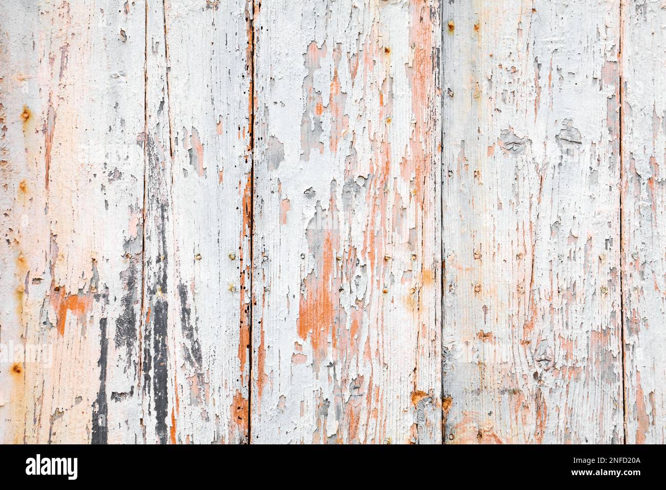 Wooden background. White peeling paint wooden planks texture. Grunge wood vintage style background. Stock Photo