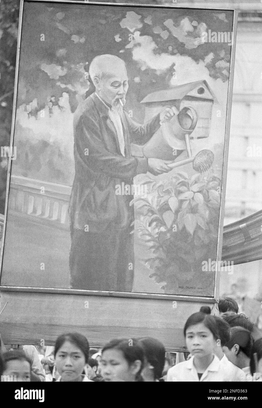 A huge poster of North Vietnamese leader Ho Chi Minh, is carried aloft ...