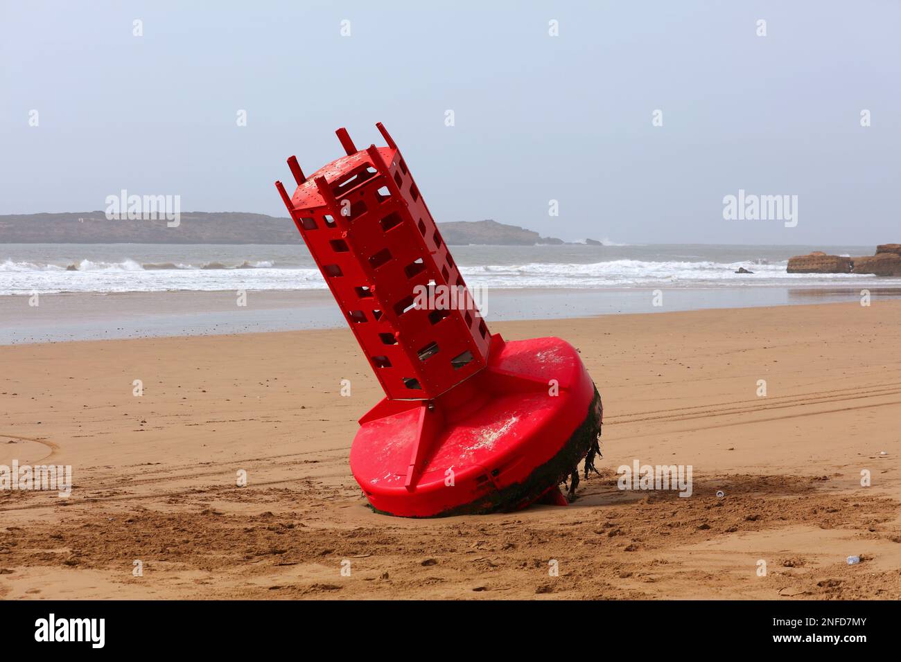 Morocco nature. Essaouira beach landscape. Stranded large marine buoy