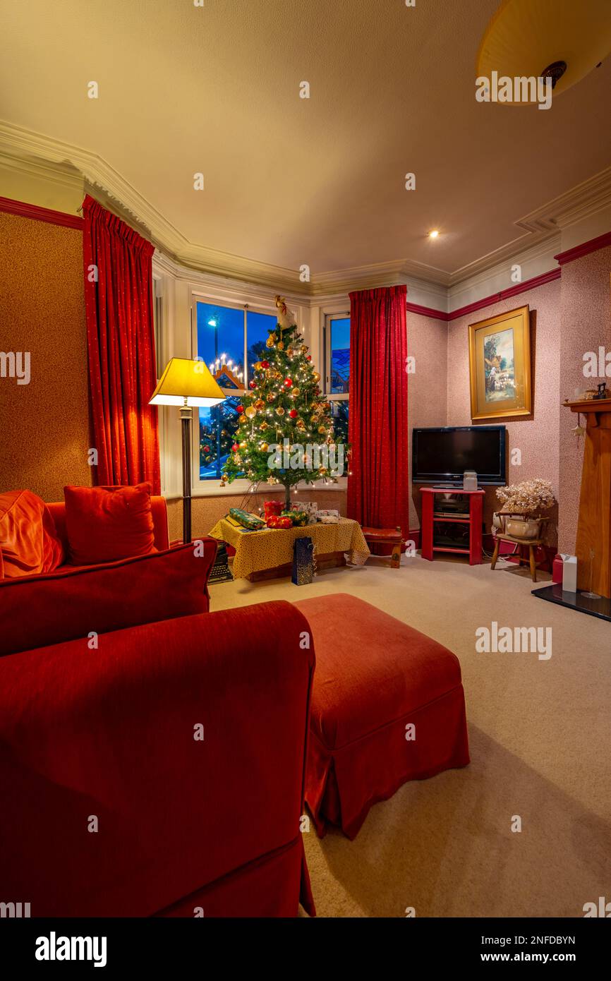 A typical lounge decorated with a Christmas tree Stock Photo Alamy