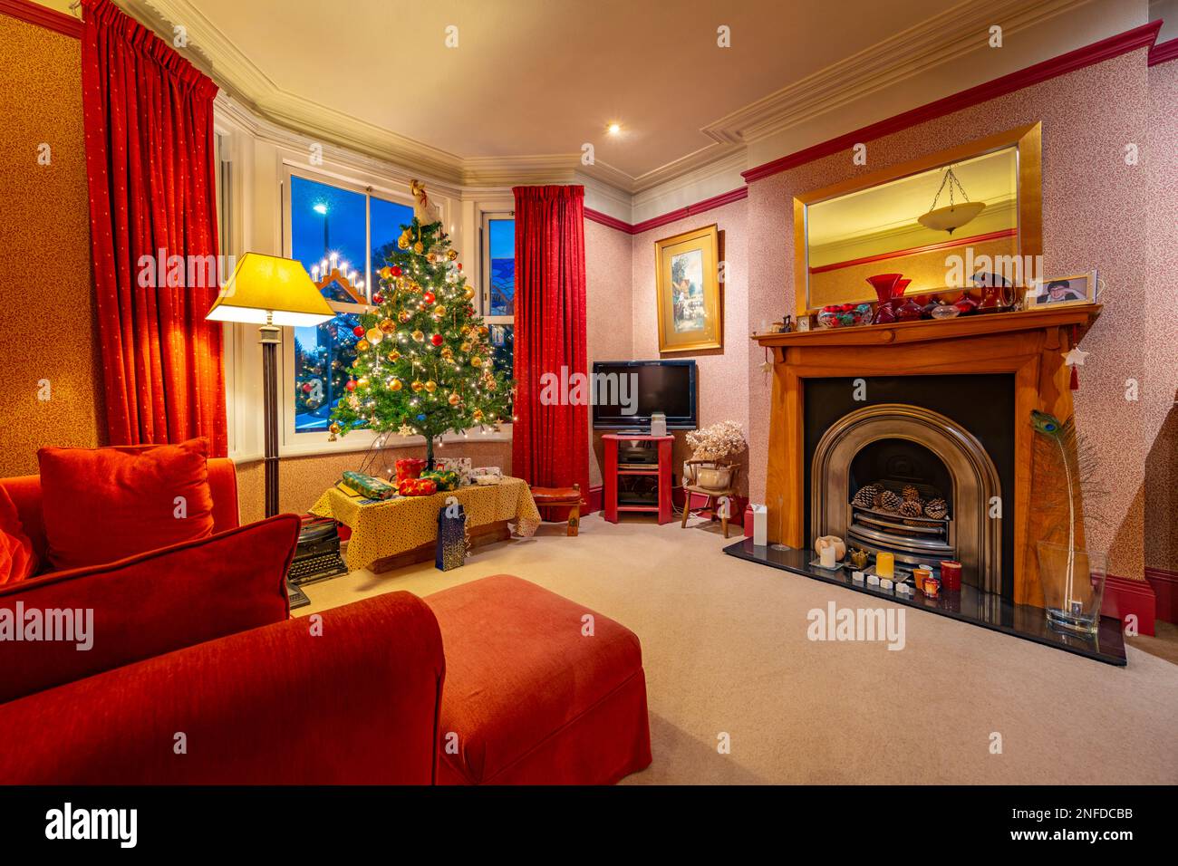 A typical lounge decorated with a Christmas tree Stock Photo Alamy