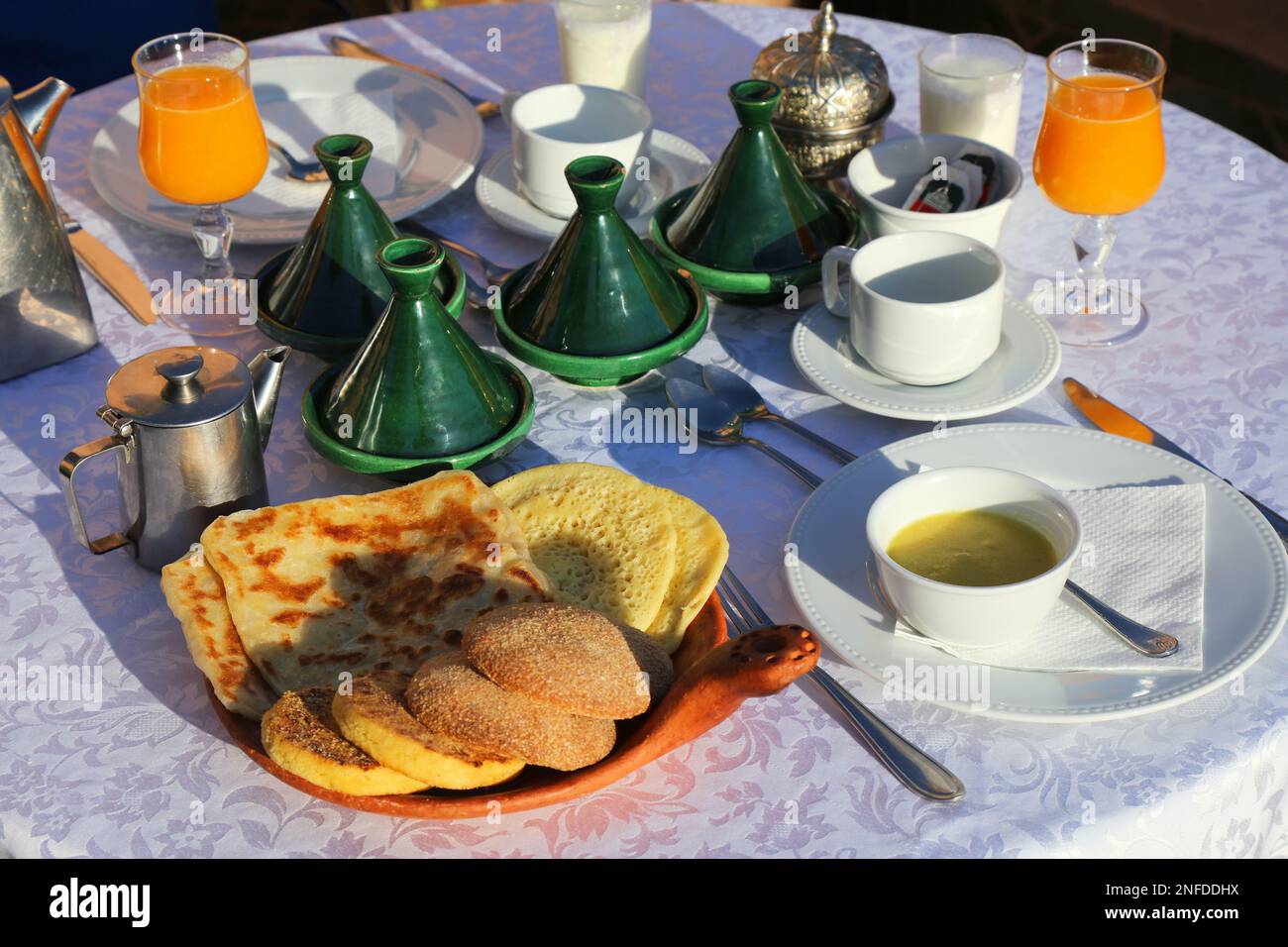 Moroccan hotel breakfast with traditional baghrir and msemen pancakes