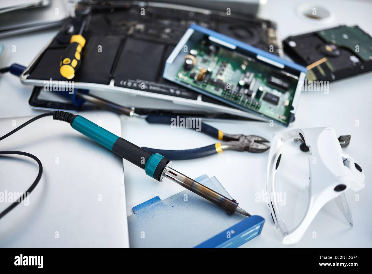 Tools, computer hardware and equipment in the office for tech repairs ...