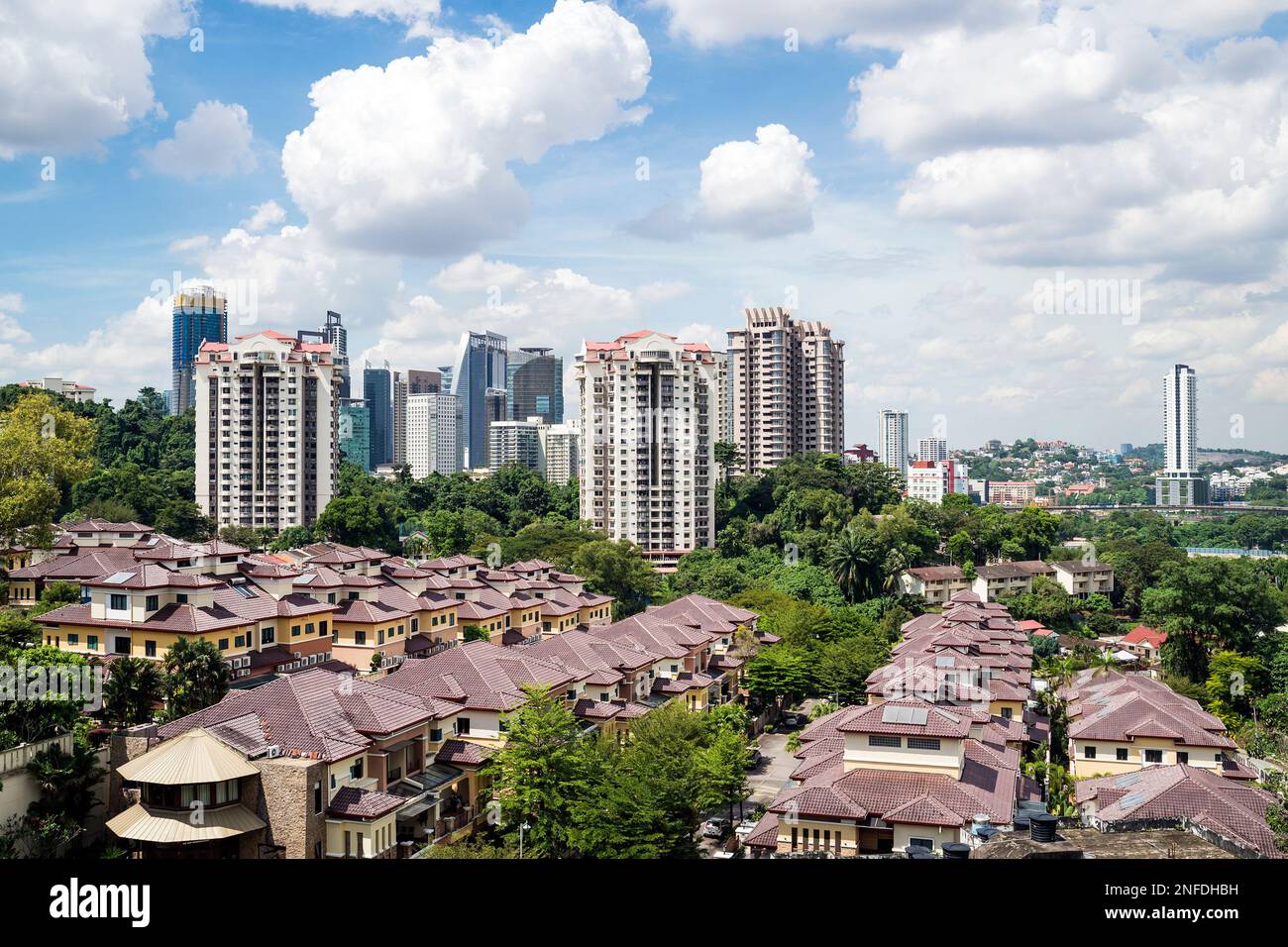 Condominium towers and low houses in Kuala Lumpur, Malaysia Stock Photo
