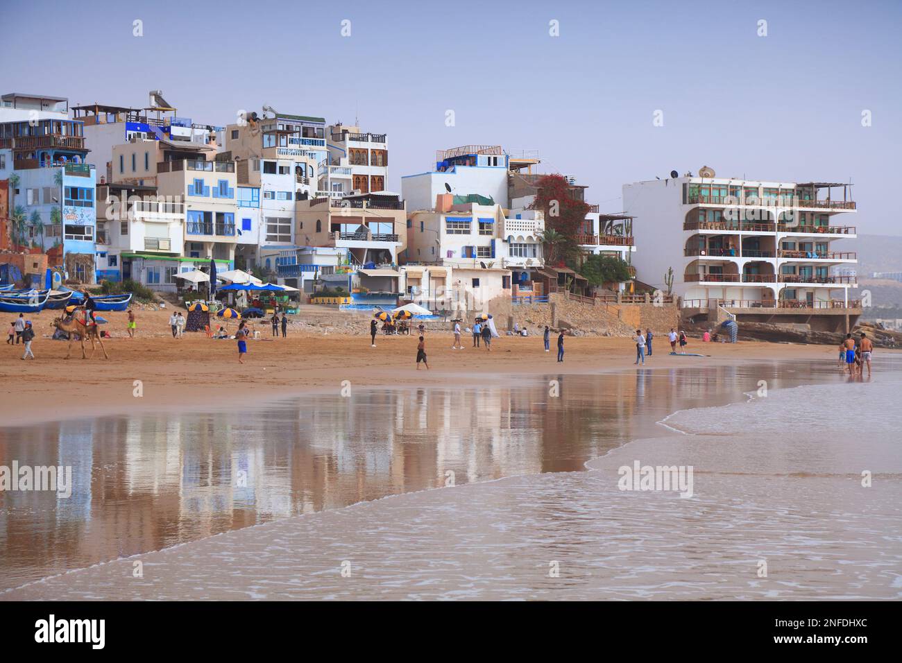 TAGHAZOUT, MOROCCO FEBRUARY 27, 2022 People visit the beach in