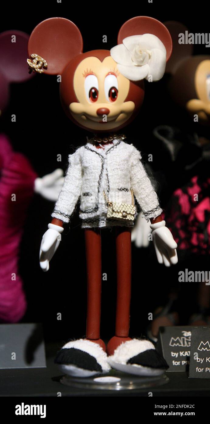A Minnie doll by designer Karl Lagerfeld for Chanel is seen during a  charity auction of 80 Disney Minnie dolls, by 80 designers, to mark the  80th anniversary of Mickey Mouse, at