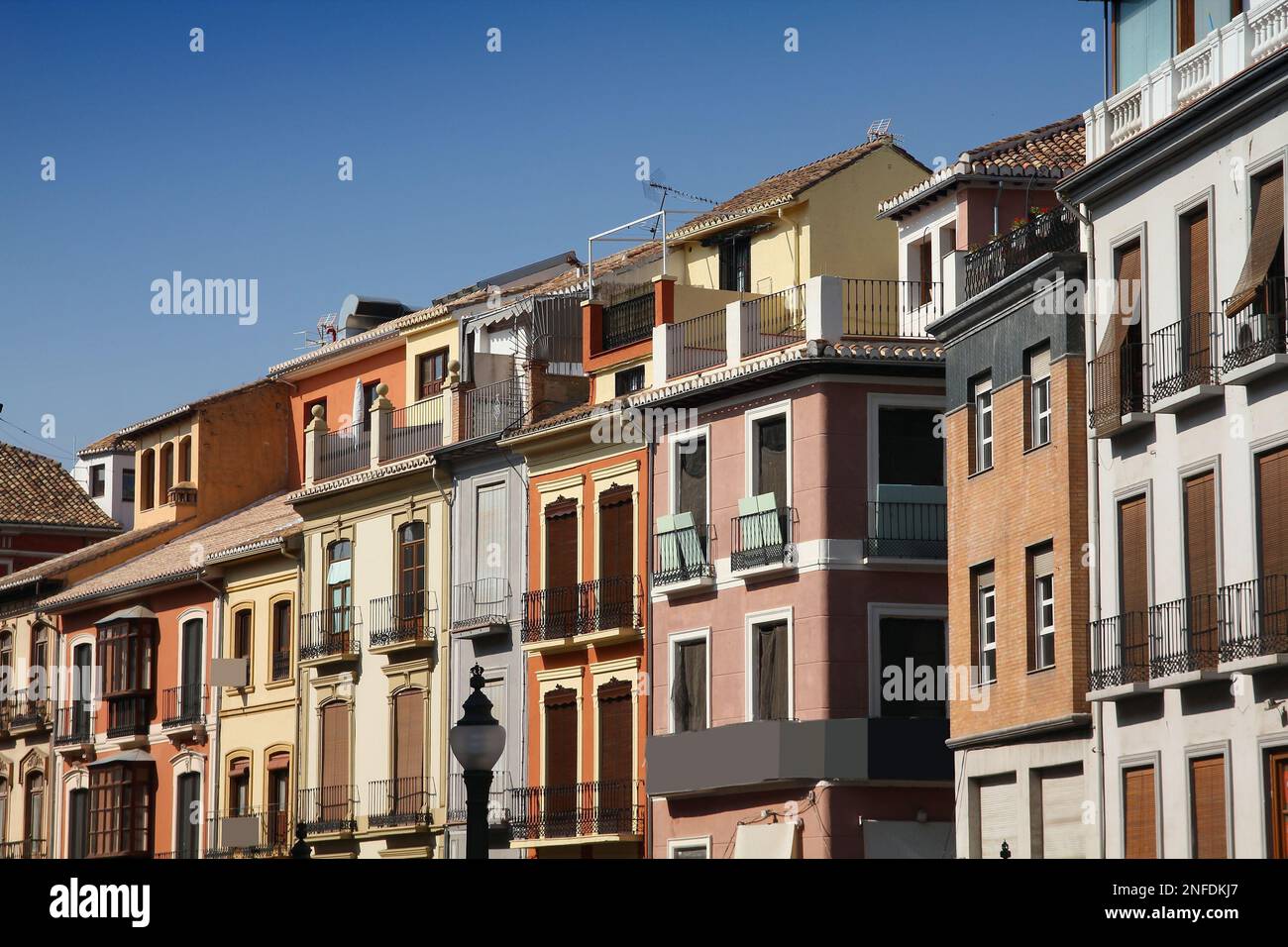 Granada in Andalusia region of Spain. Old apartment buildings street