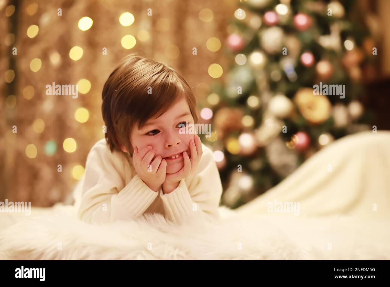 Family on Christmas eve at fireplace. Kids opening Xmas presents Christmas Eve Traditiona