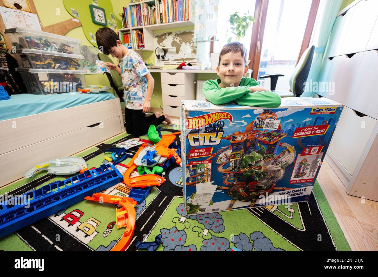 Ternopil, Ukraine - February, 2023: Kids unboxing Hot Wheels City