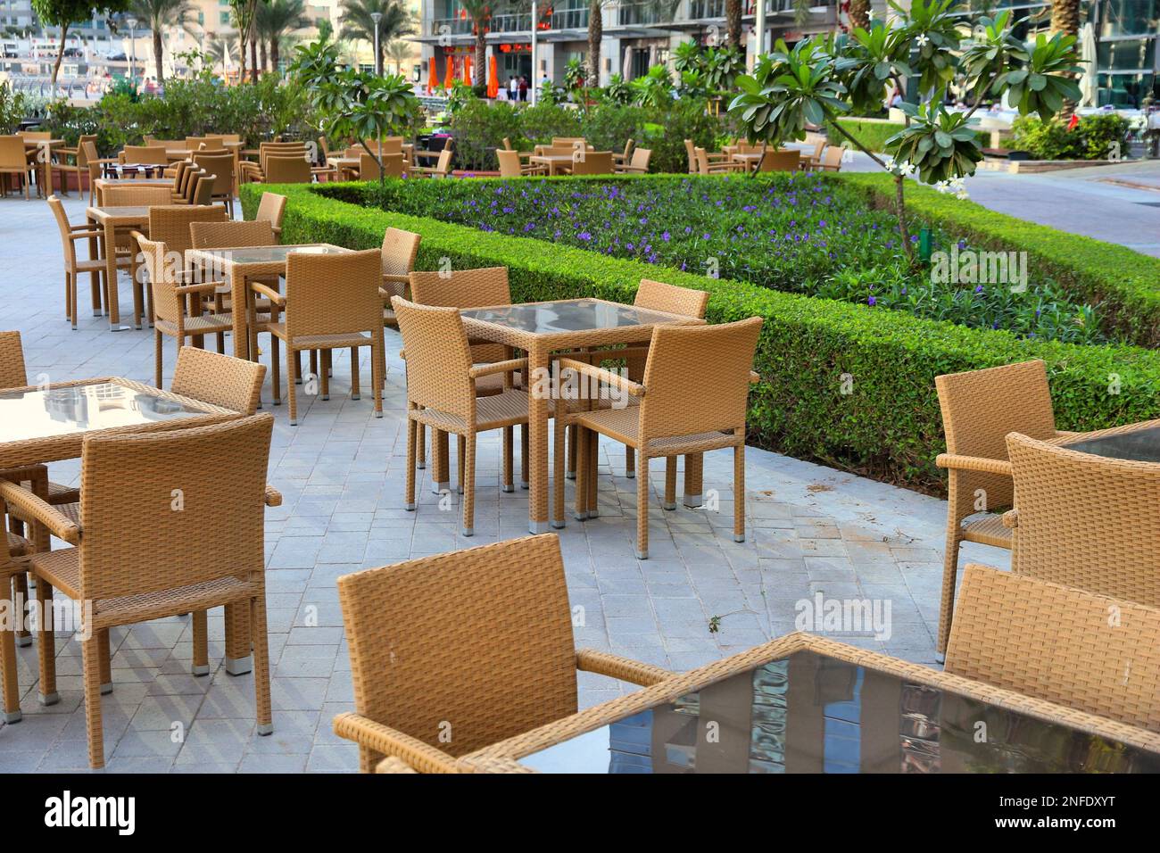 Modern city restaurant outdoor tables in Dubai. Synthetic rattan