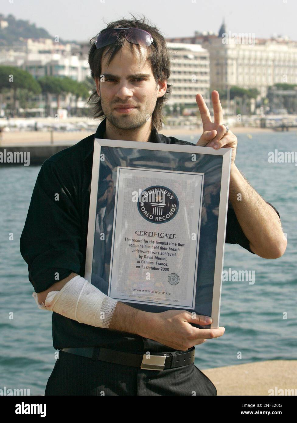 Hungarian escape artist David Merlini poses with his &ldquo;Guinness World