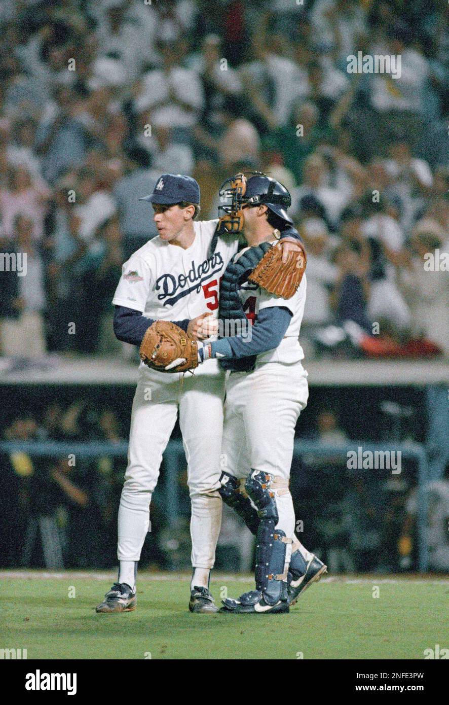Los Angeles Dodgers Orel Hershiser, left, is congratulated by catcher Mike  Scioscia following his 6-0 shutout of the Oakland A's in the second game of  the World Series at Dodger Stadium in