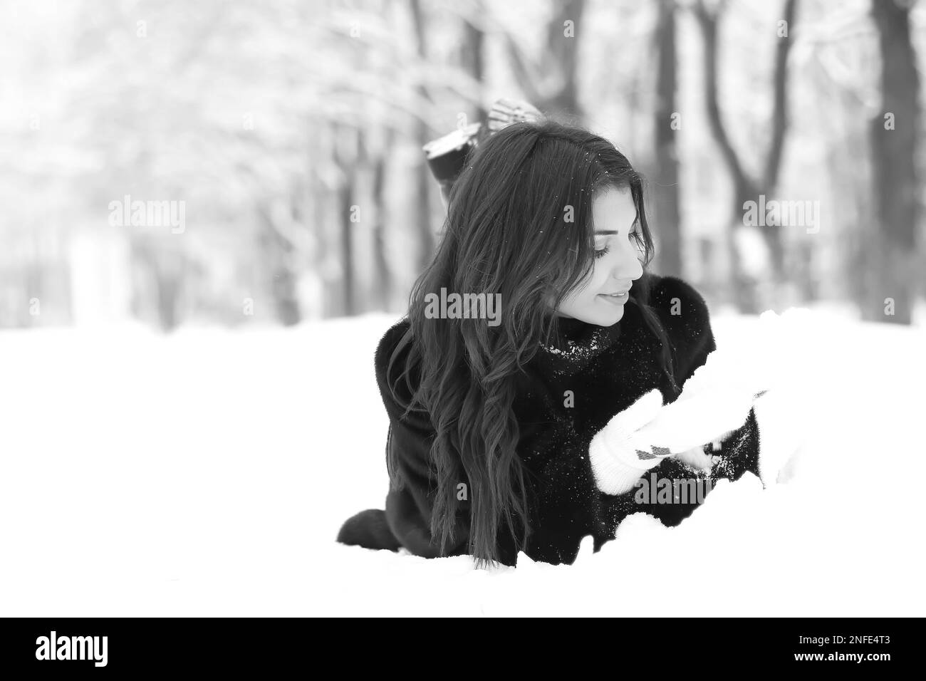 Young girl on a walk in a winter snowy day in the park Stock Photo - Alamy