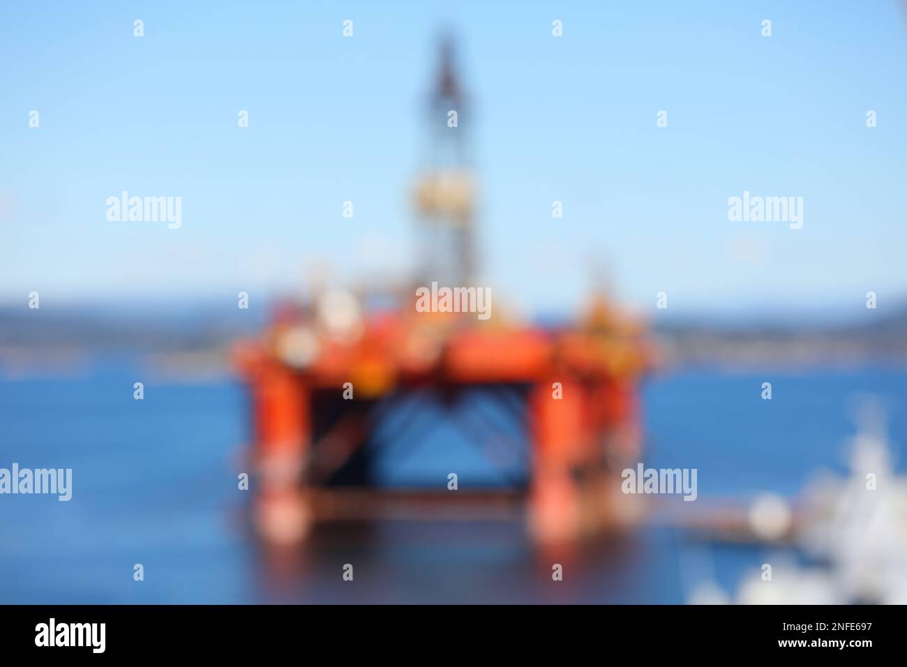 Abstract oil rig background. Offshore oil drilling platform defocused image. Stock Photo