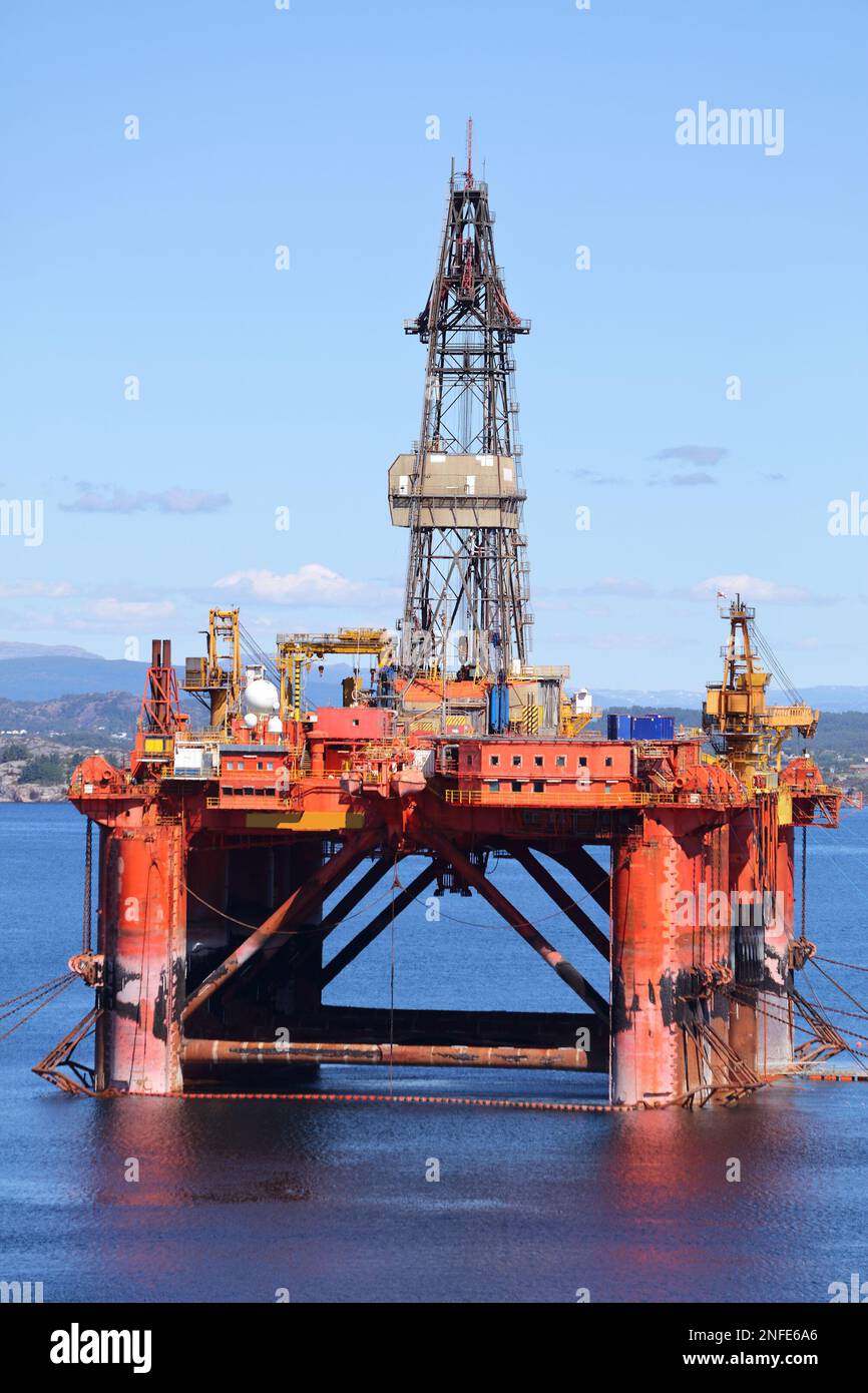 Offshore drilling rig maintenance in a fiord near Bergen, Norway. Oil industry structure. Stock Photo