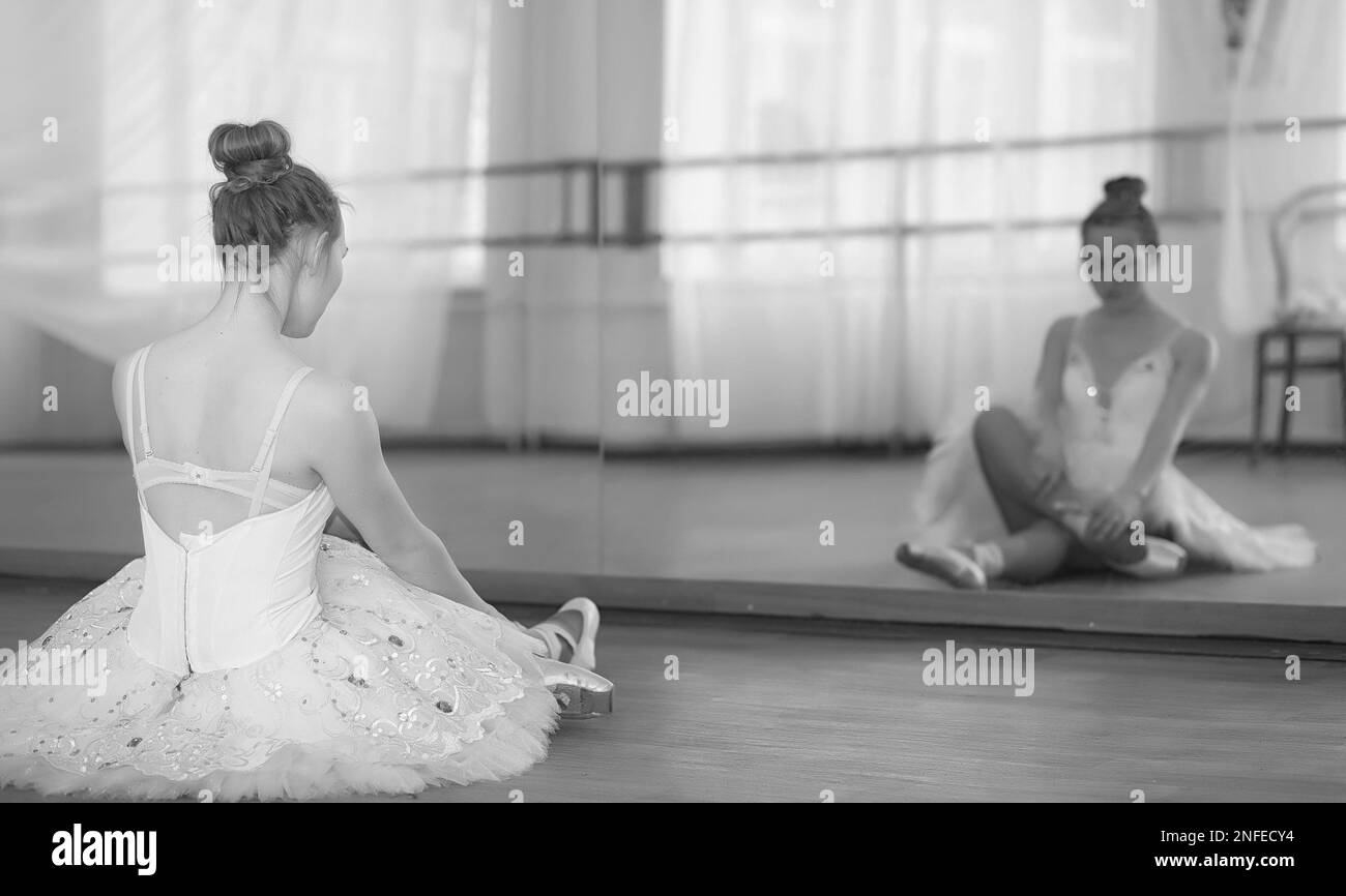 Young ballet dancer on a warmup. The ballerina is preparing to perform