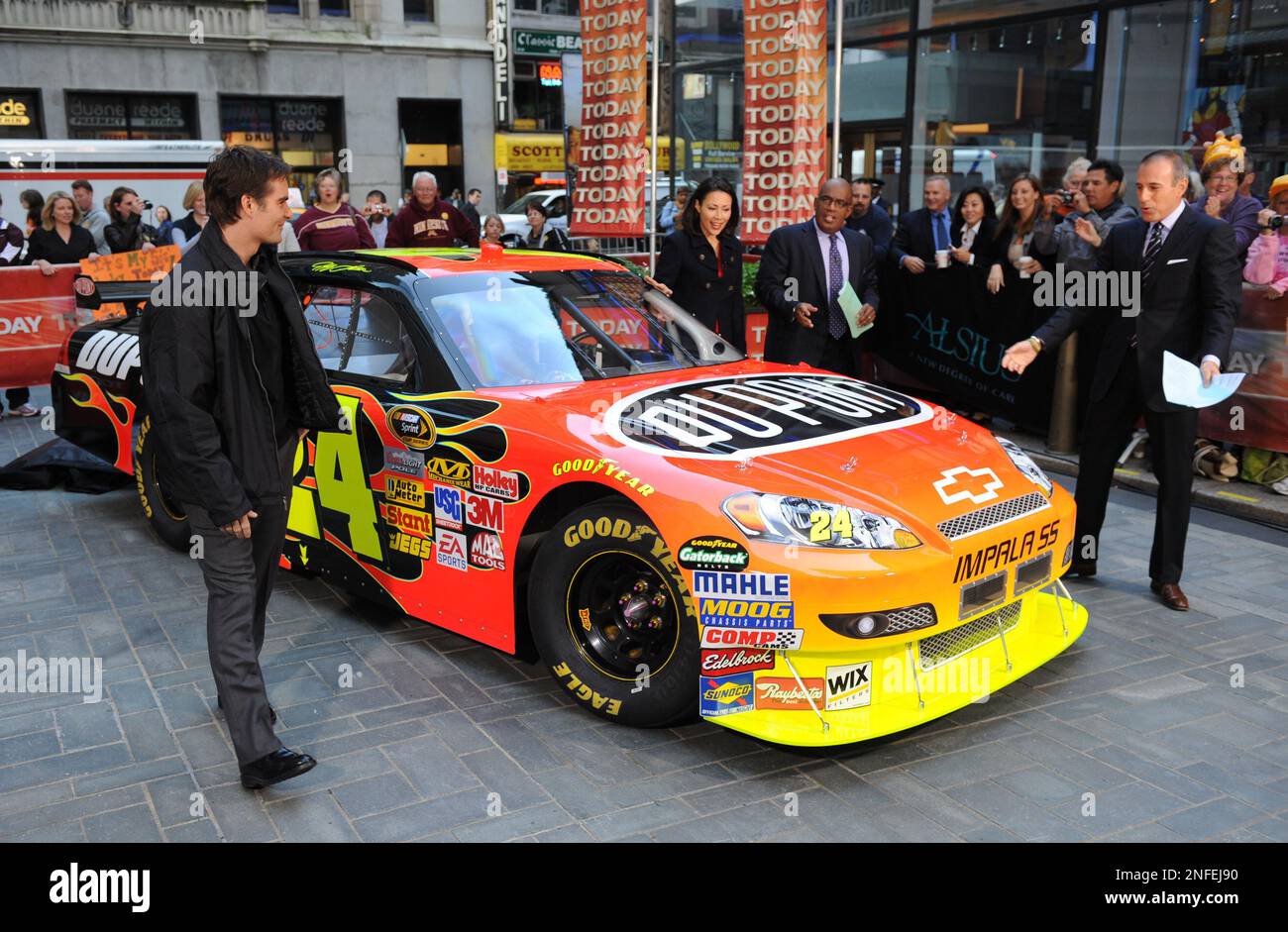 Jeff Gordon, left, with help from the 