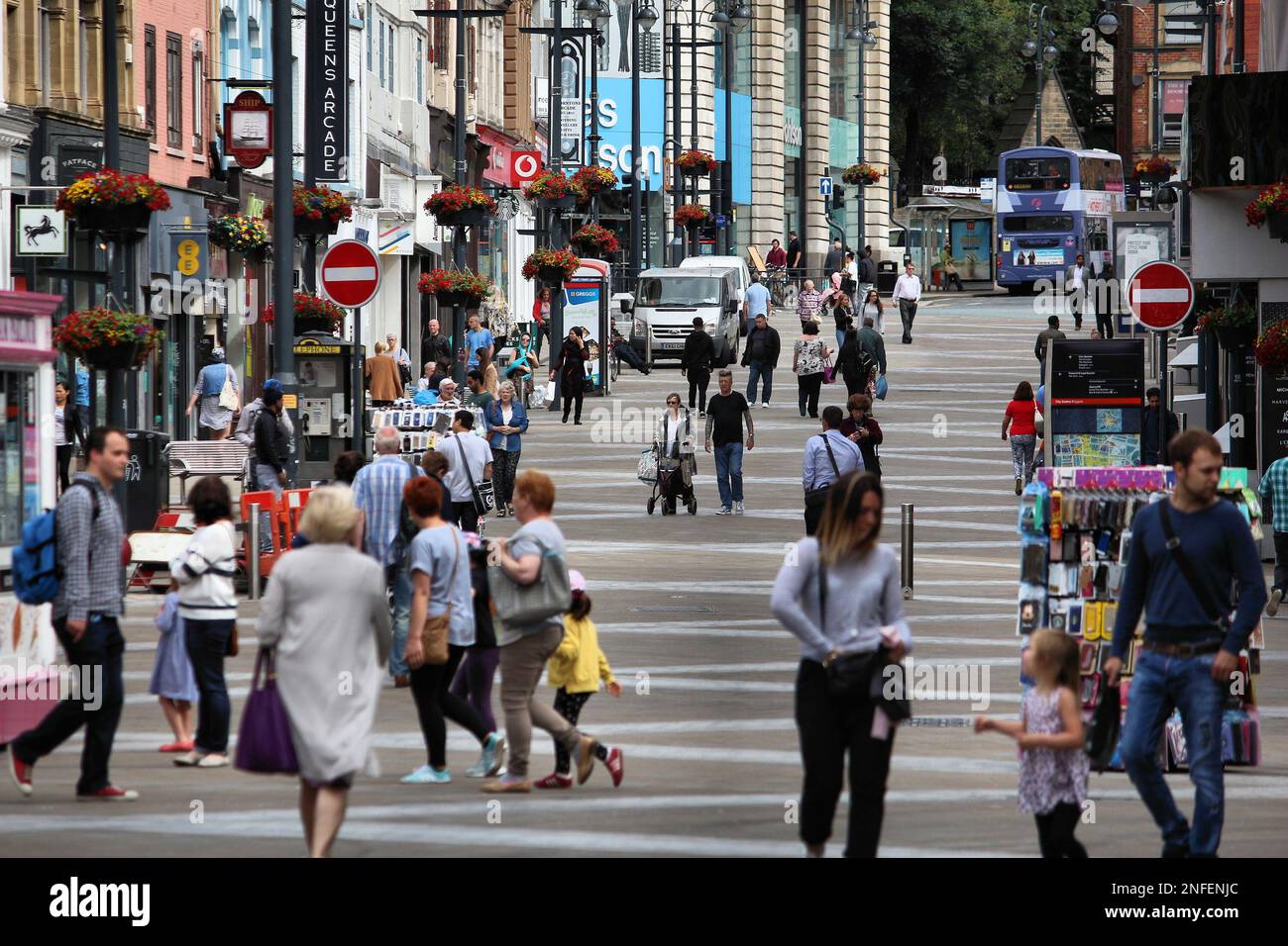 LEEDS, UK - JULY 12, 2016: People shop at Briggate street in downtown Leeds, UK. Leeds urban area has 1.78 million population. Stock Photo