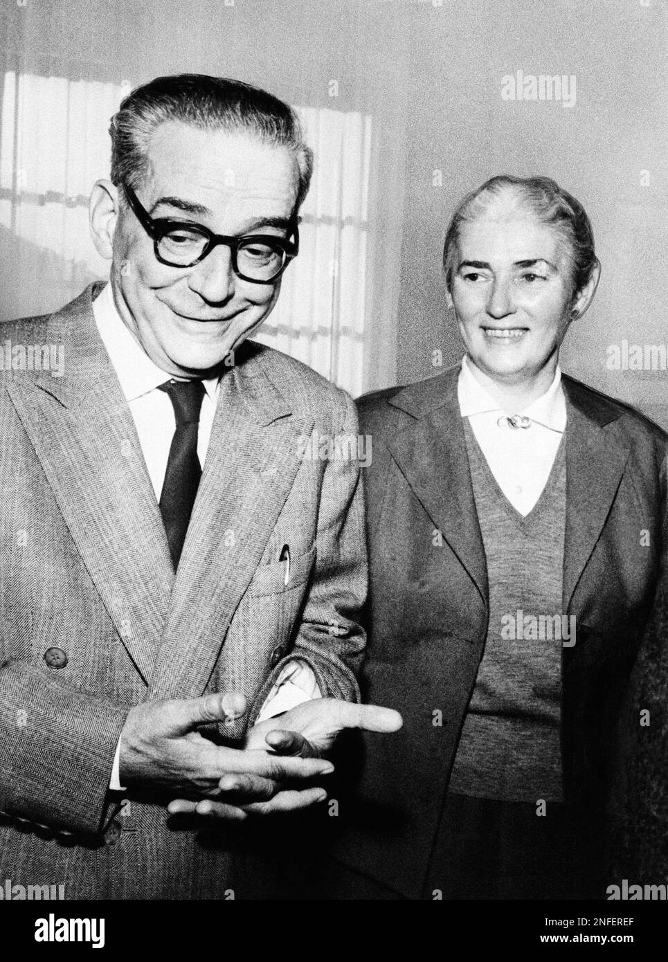 Ivo Andric, 65-year-old Yugoslav diplomat-writer who has been awarded the 1961 Nobel Prize for literature, is shown with his wife Milica Babic-Andric in their Belgrade home recently after he had been given the award, Oct. 31, 1961. Costume designer for the theater of Belgrade. Andric's wife is a costume designer for the theater of Belgrade. (AP Photo) Stock Photo