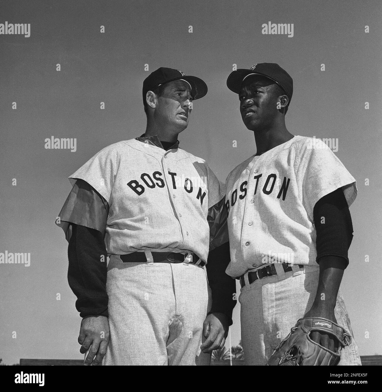 Ted Williams, long-time Red Sox batting ace, chats with E.J. (Pumpsie) Green  at the Boston training camp in Scottsdale, Ariz., March 4, 1959. Green is  down as an infielder but doesn't know