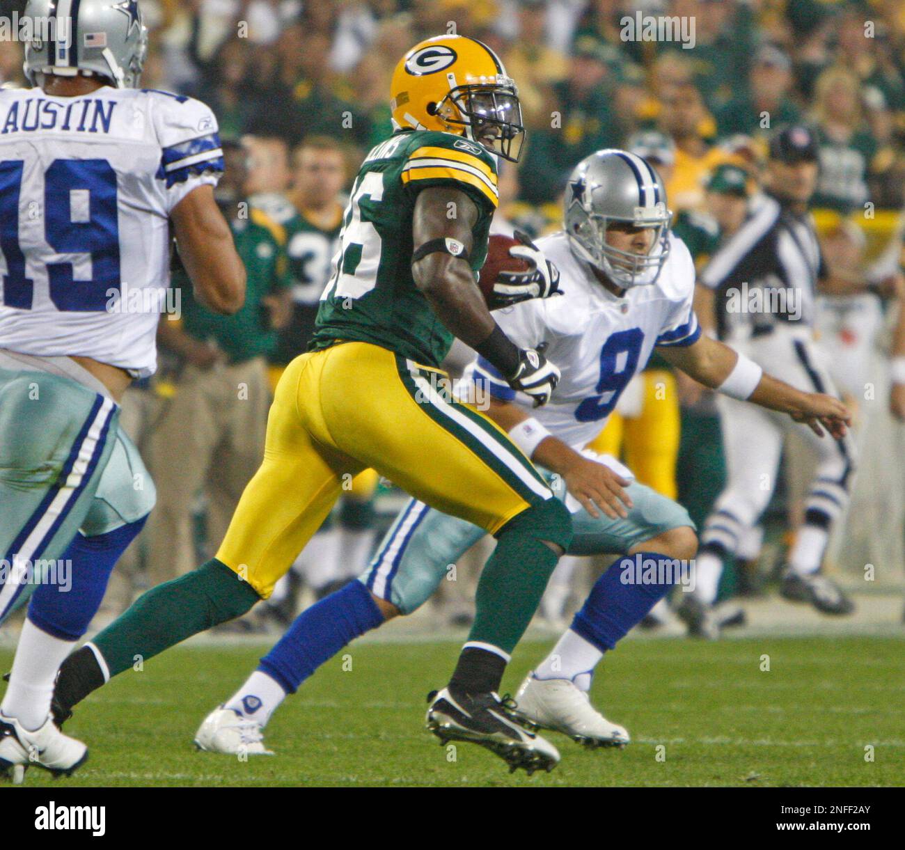 Green Bay Packers' Nick Collins runs back an interception as Dallas