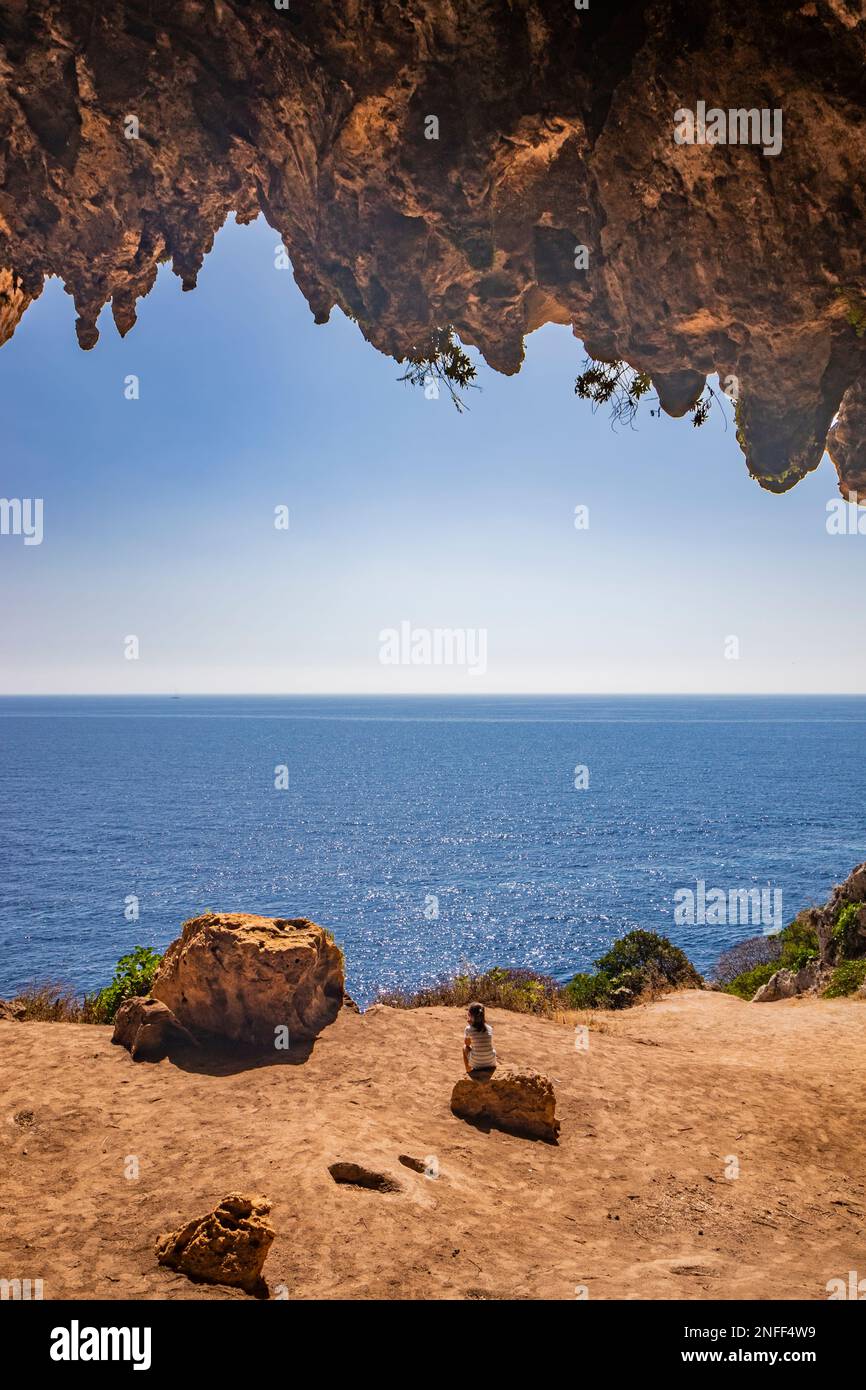 Gagliano del Capo. The spectacular Cipolliane caves, on the rocky cliff of Salento, where you can admire an amazing panorama of the blue sea. The entr Stock Photo