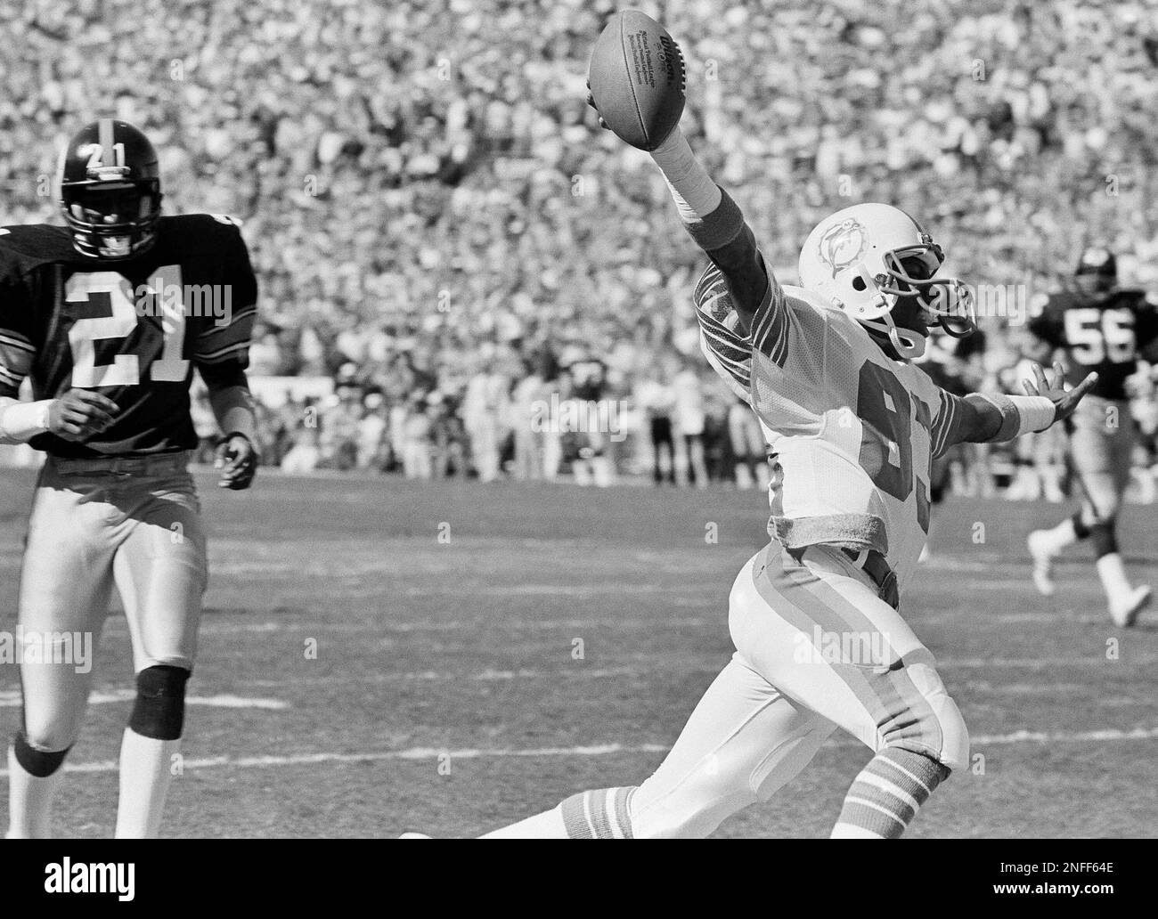 Miami Dolphins wide receiver Mark Clayton goes across the goal line for a  touchdown against the Pittsburgh Steelers in first half action of the AFC  Championship in Miami, Sunday, Jan. 6, 1984.