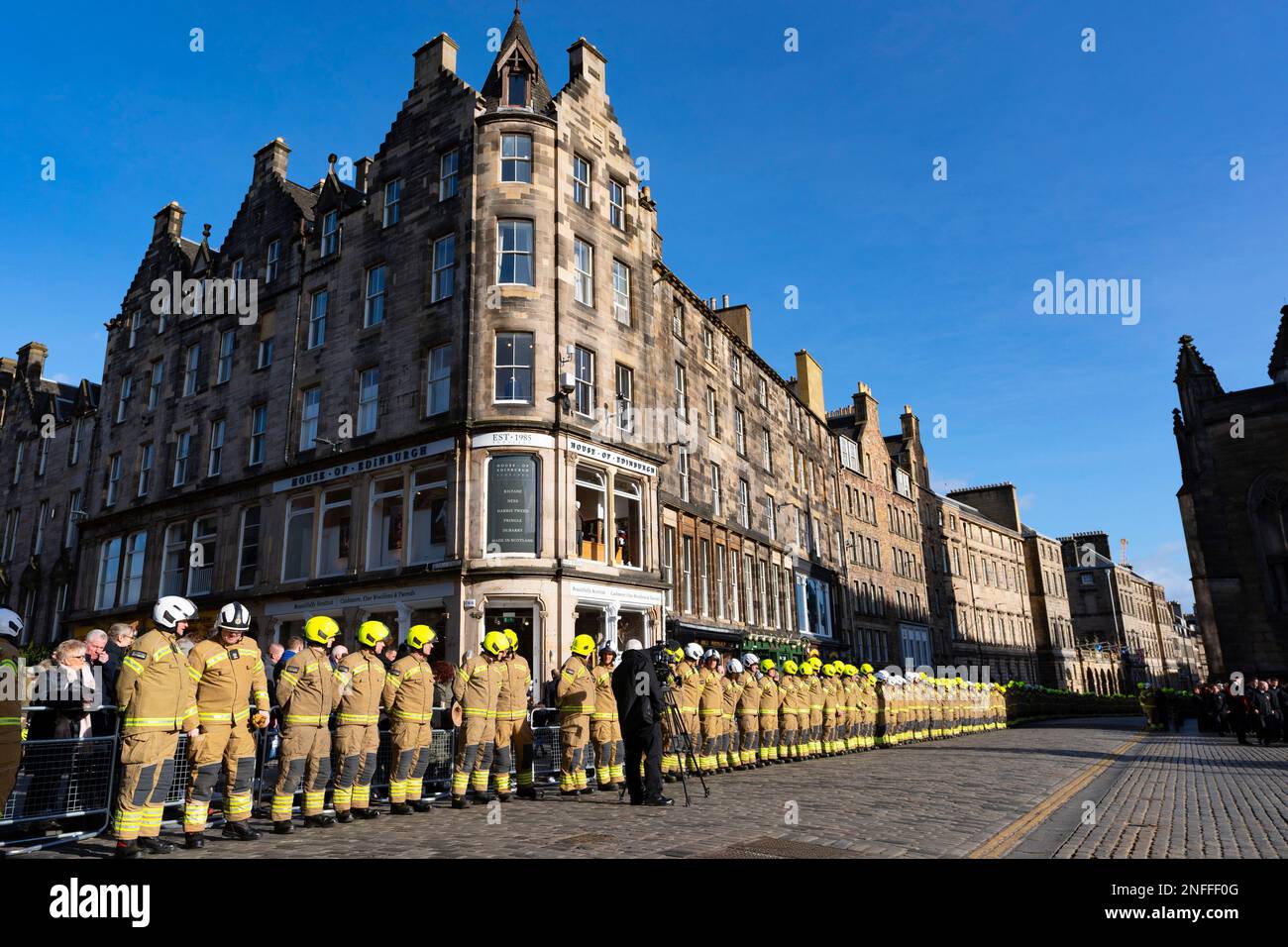 Edinburgh, Scotland, UK. 17 February 2023. The public and firefighters pay respects at funeral of firefighter Barry Martin at St Giles Cathedral on the Royal Mile in Edinburgh today. Mr Martin died following a fire at former Jenners department store which was being redeveloped at the time of the fire. Firefighters line the Royal Mile awaiting funeral cortege.  Iain Masterton/Alamy Live News Stock Photo