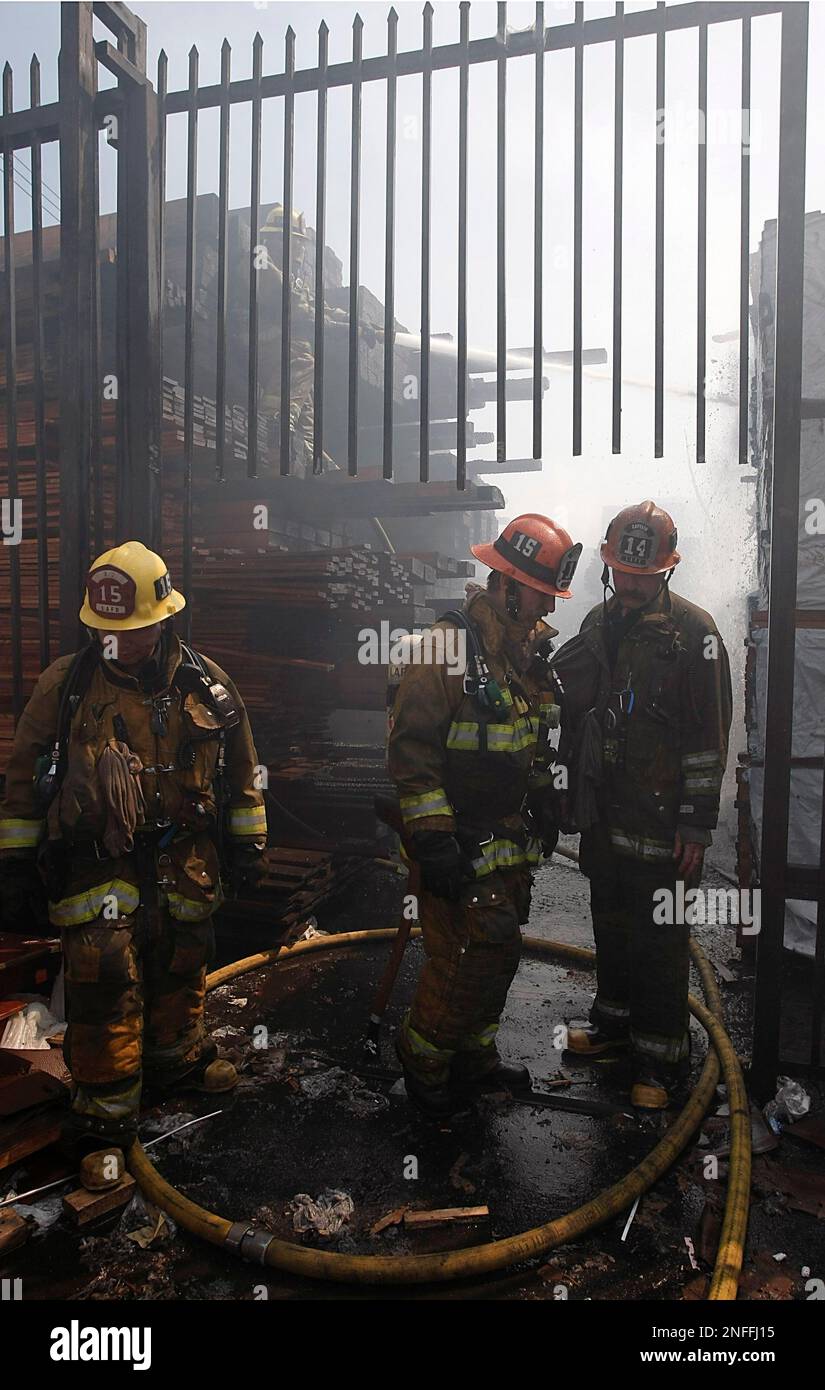 Los Angeles City Fire Department firefighters battle an afternoon blaze ...