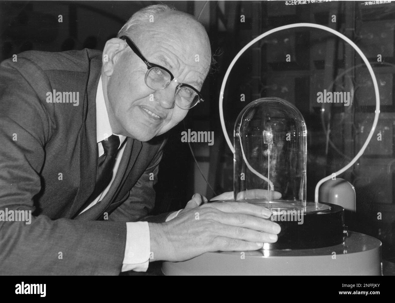 Jack Kilby poses with his original 1958 invention, the worlds first