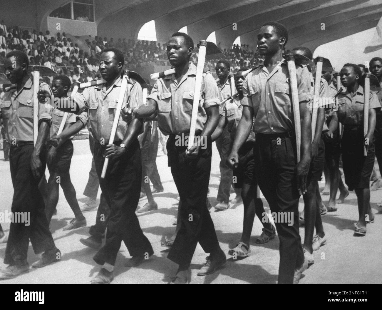 Tanganyika African National Union (TANU) youth league members march past Tanzanian President