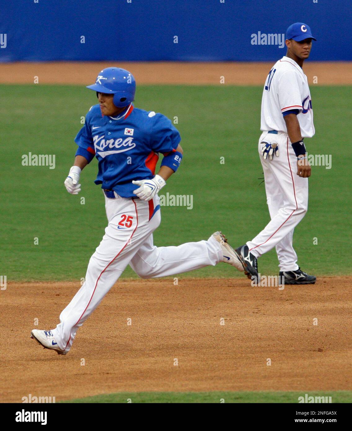 South Korea's Lee Seungyuop (25) rounds the bases after hitting a home