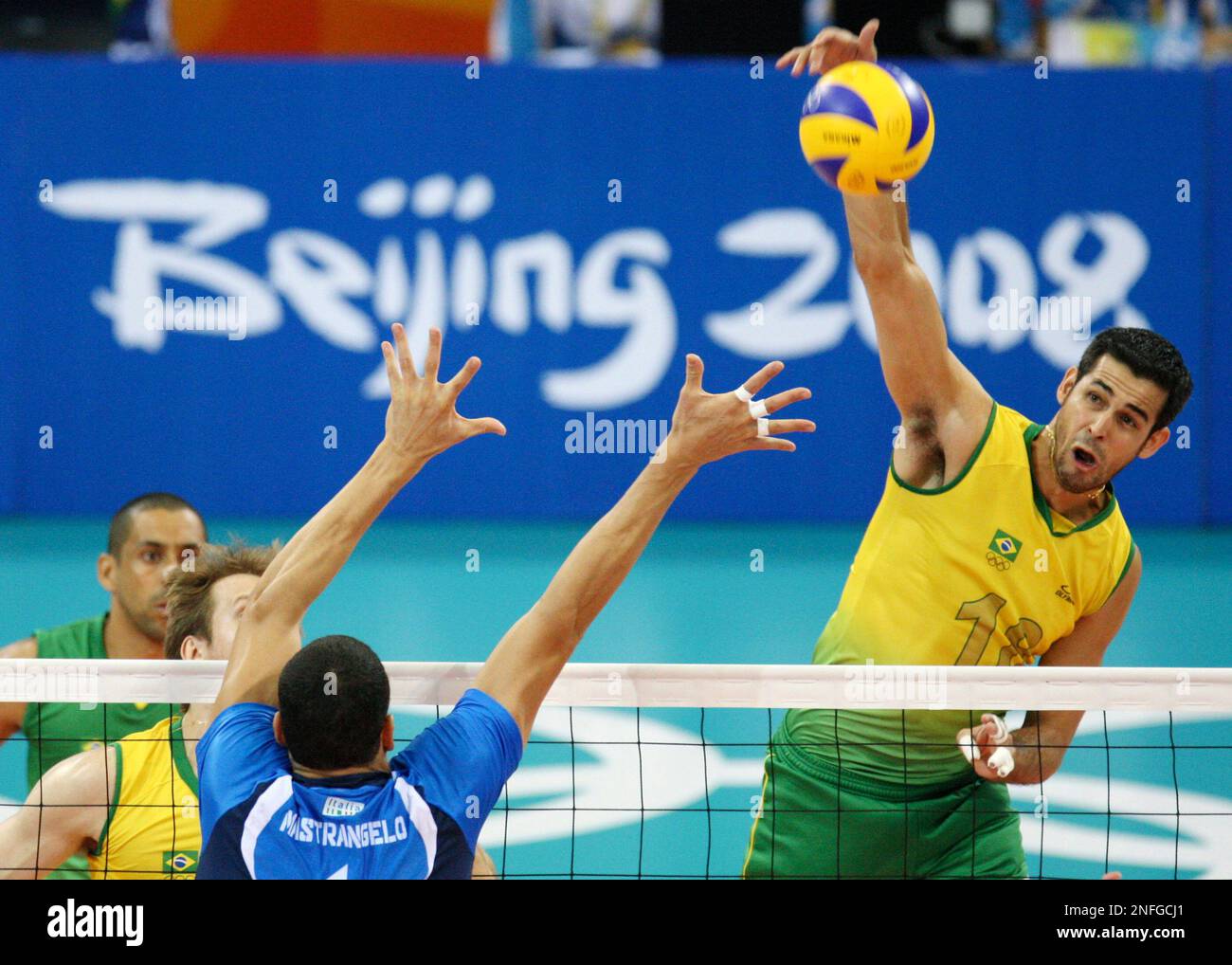 Dante Amaral of Brazil spikes against Luigi Mastrangelo of Italy in a men's semifinals volleyball match during the Beijing 2008 Olympics in Beijing, Friday, Aug 22, 2008. (AP Photo/Koji Sasahara) Stock Photo