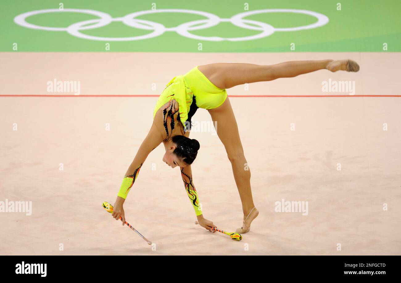 Korea's gymnast Shin Sooji performs with the clubs during the gymnastics rhythmic individual all-around qualification at the Beijing 2008 Olympics in Beijing, Friday, Aug. 22, 2008. (AP Photo/Odd Andersen) Stock Photo